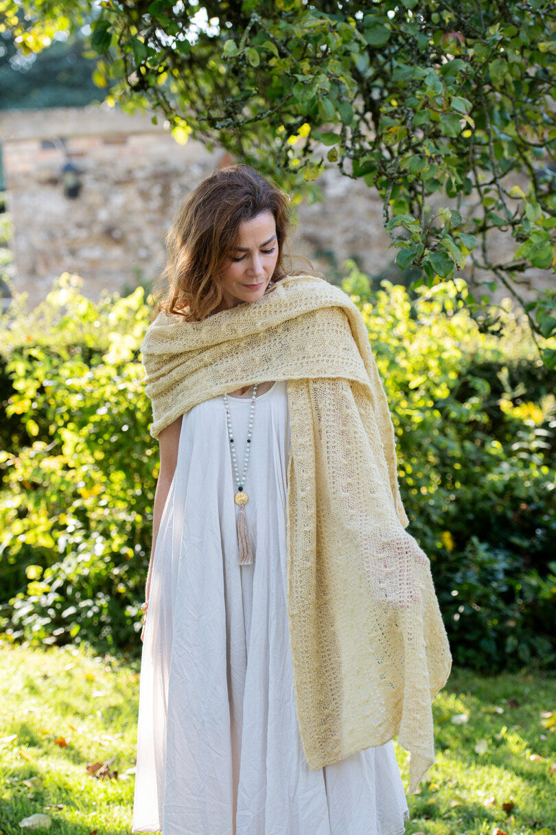 Sovereignty Shawl in Honeybee folded over model's shoulders